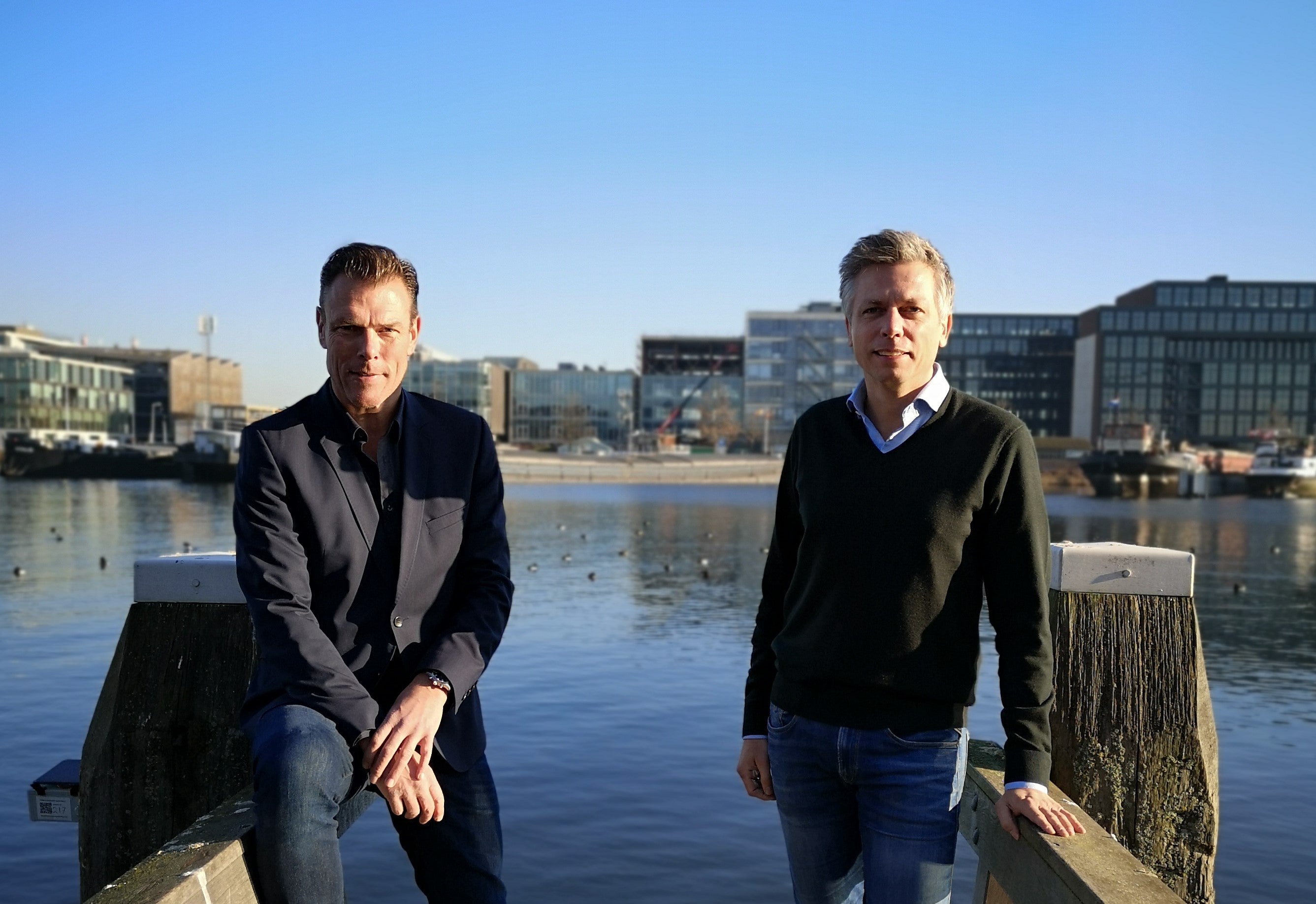Julius Minnaar and  Mark van Dijk two men posing by the water