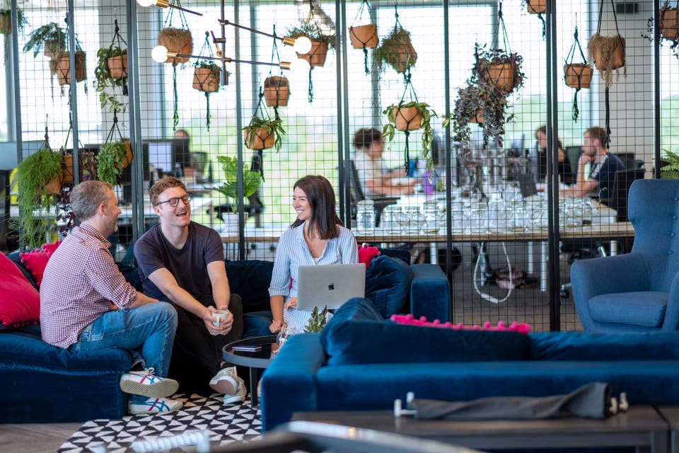 3 people sitting around talking