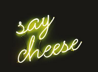 Neon sign saying 'Say Cheese'