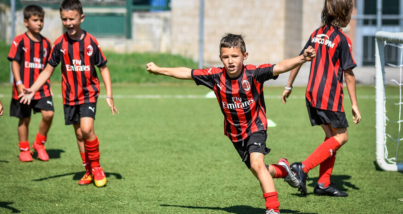 AC Milan Junior Camp take part in the Milan summer camp