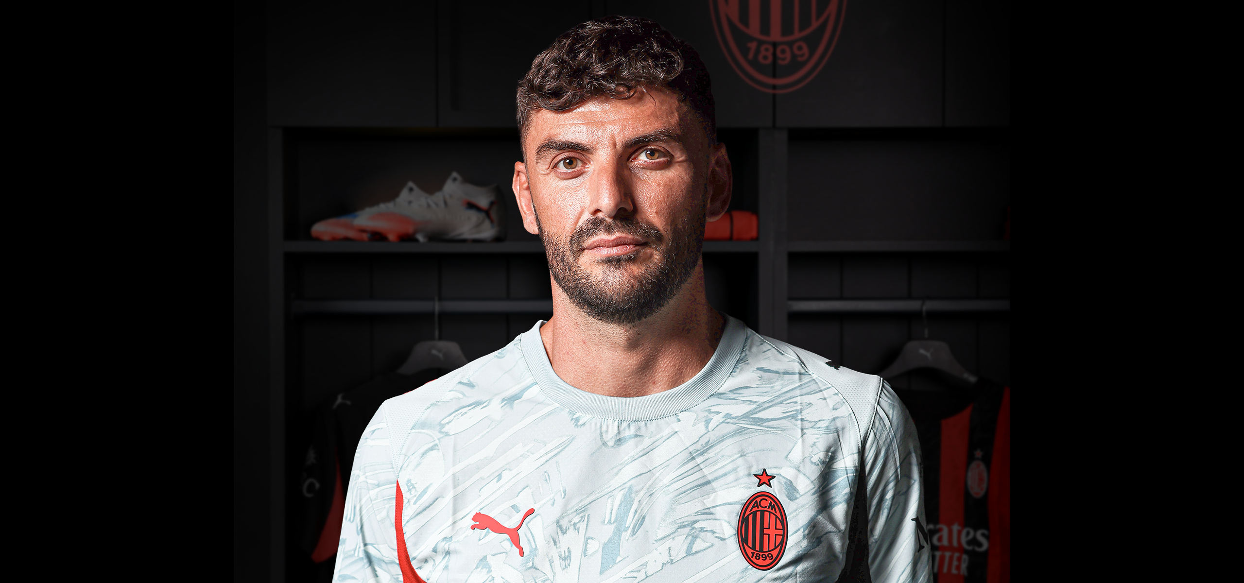 Pietro Terracciano standing behind the locker room, in the foreground some inscriptions with his personal details