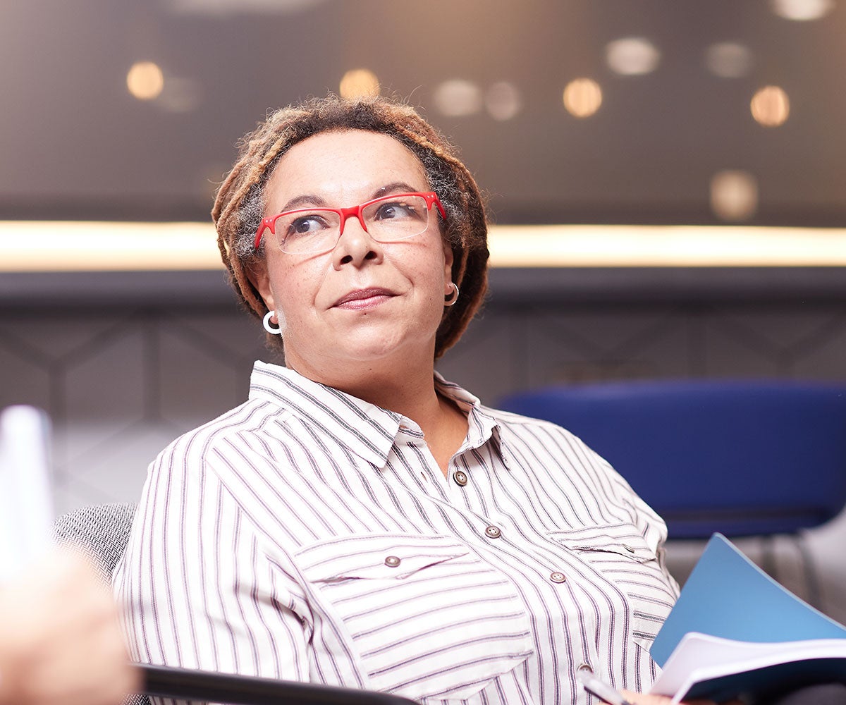 Lady with red glasses having a conversation