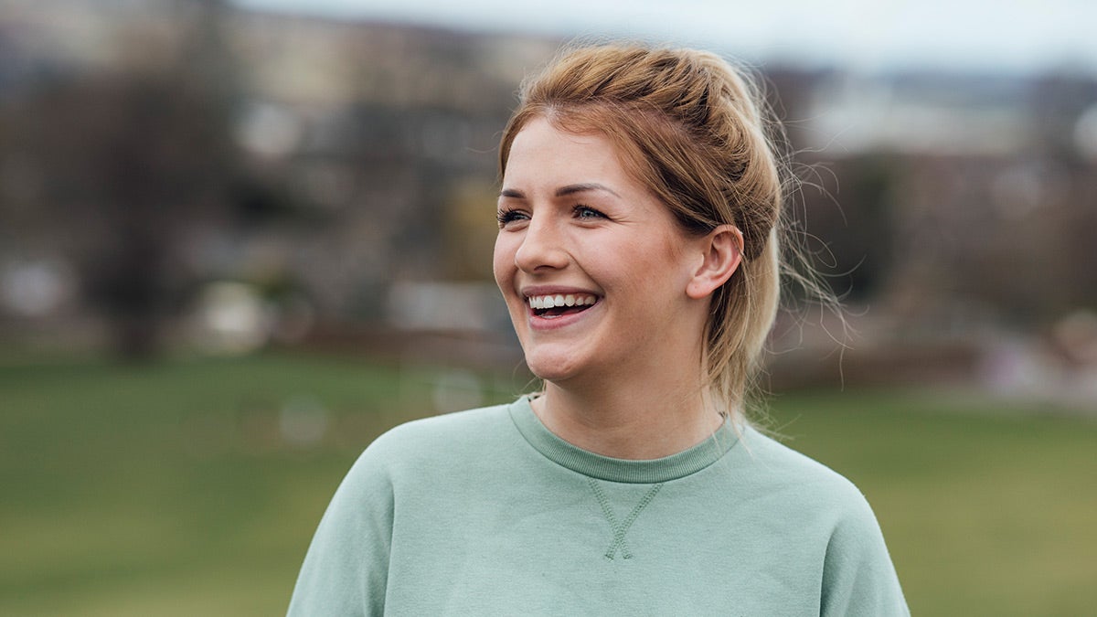 Happy woman in green top