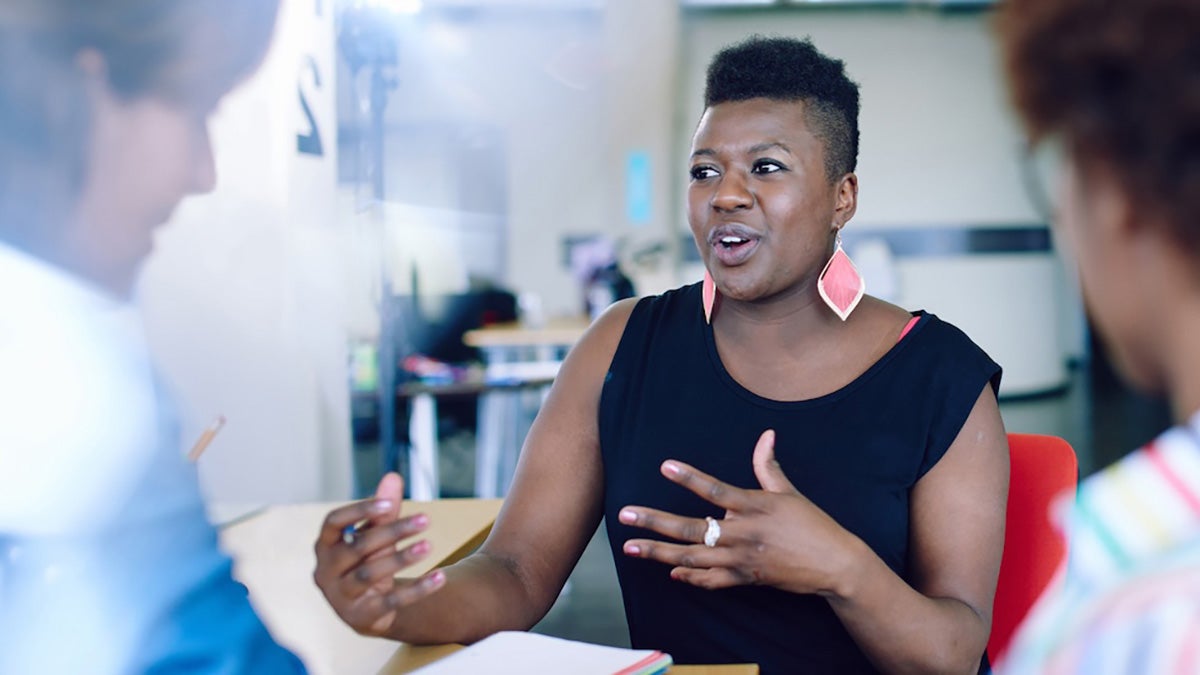 A woman talking to another woman