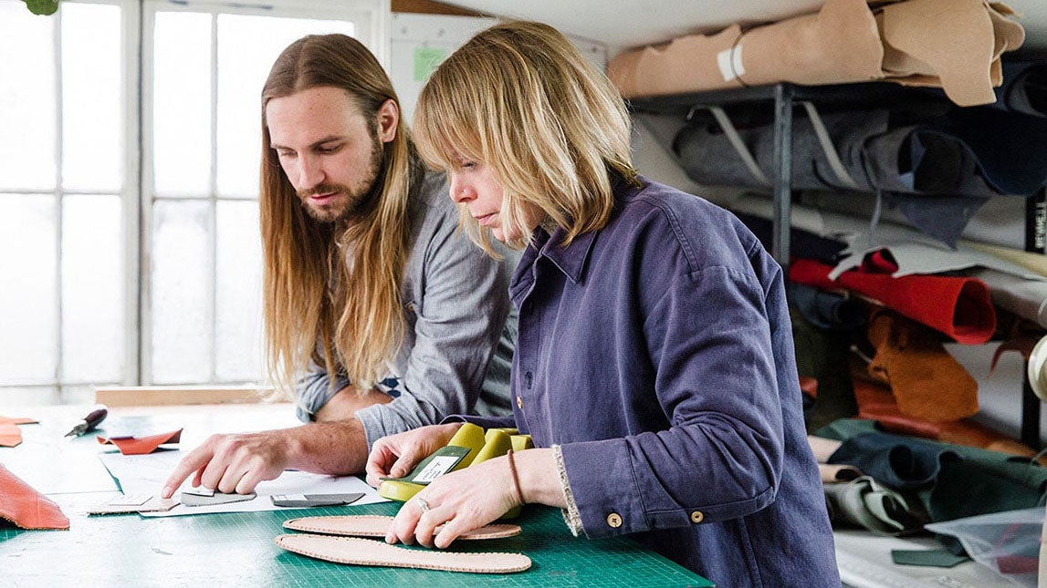 Two shoe makers collaborating