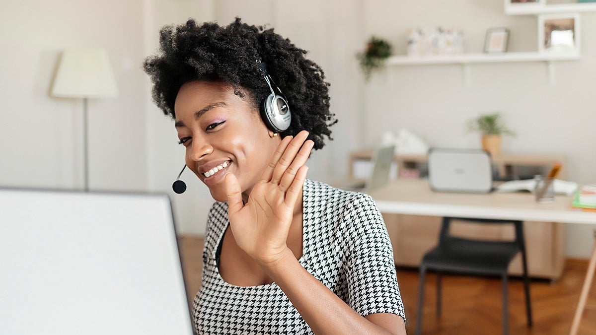 Smiling lady on the teleconference