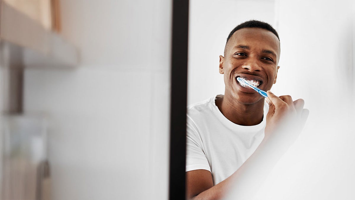 A man brushing his teeth