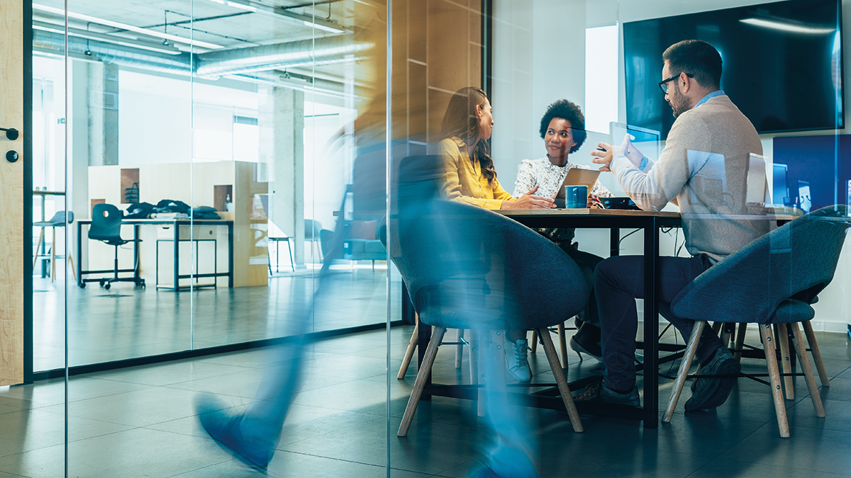 Group of people sitting at the table in the office environment