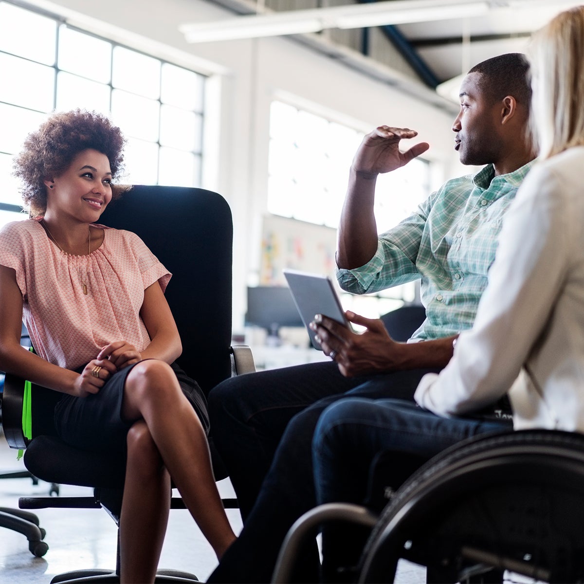 Employees in the office having a conversation