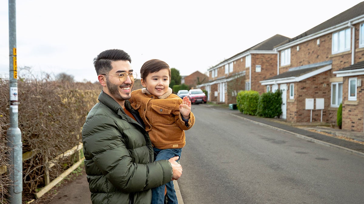 Father and son crossing the street