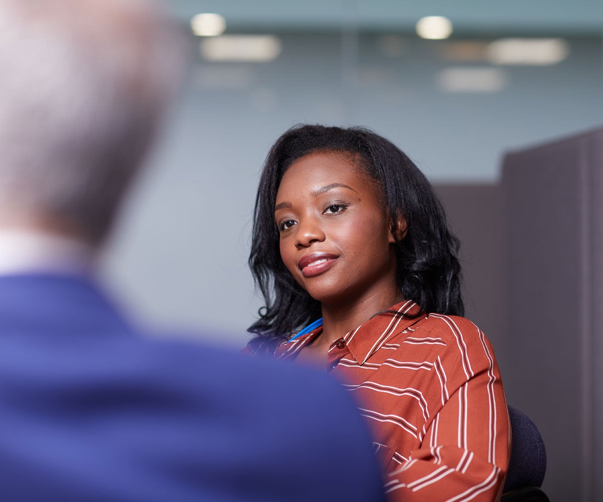 Lady in red top having a conversation