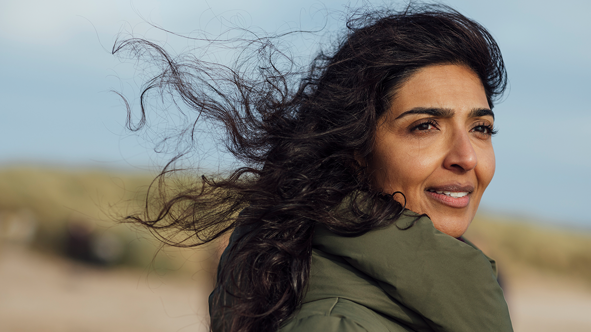 Woman looking forward on a windy day outdoors