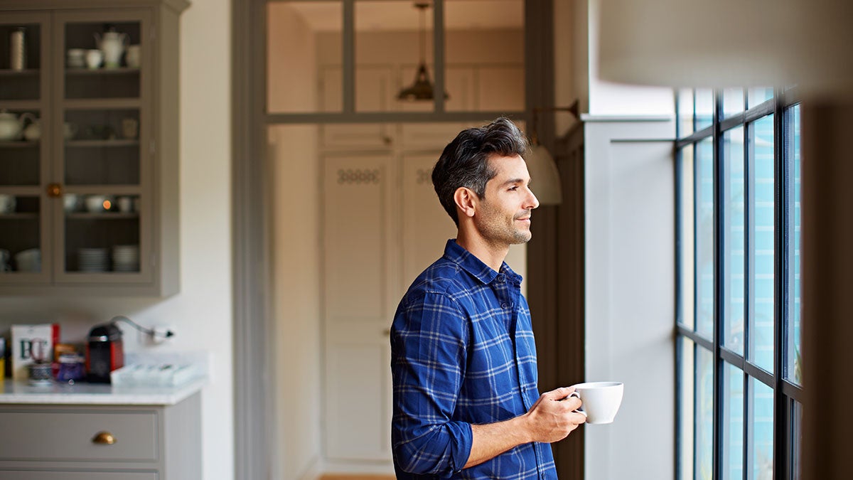 Man standing by the window