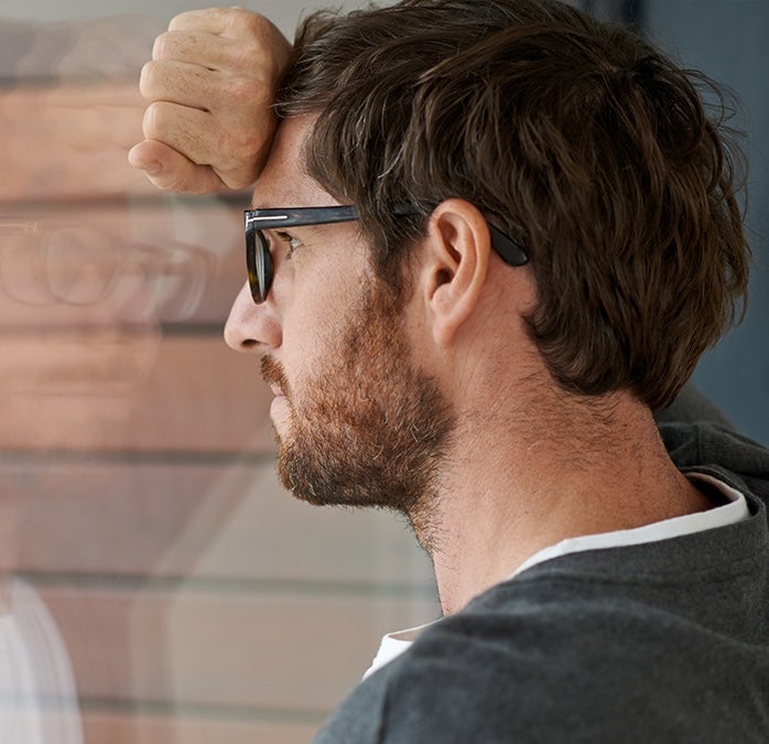 A man looking out a window