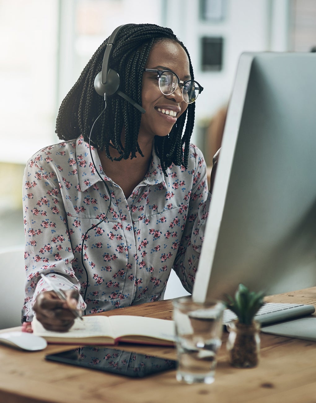 Supporting vulnerable customers. A woman on a call discussing special requirements. 