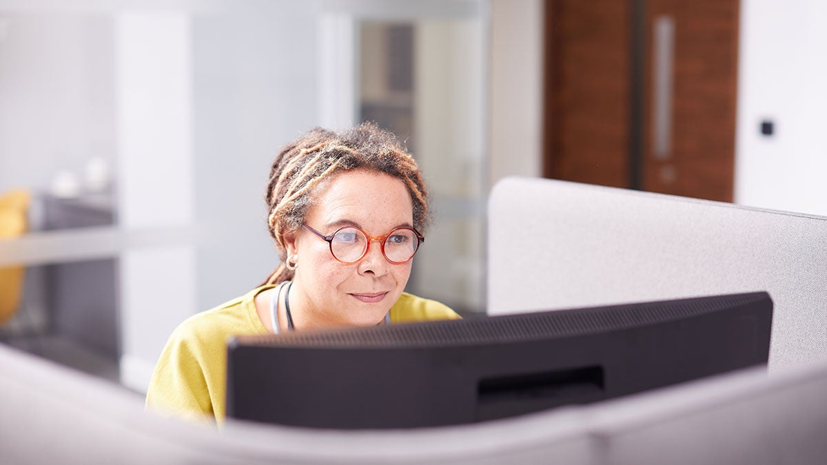 Woman typing on a computer