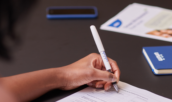 Handwriting with pen filling the form