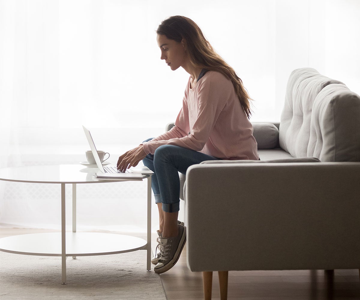 Woman typing on her laptop