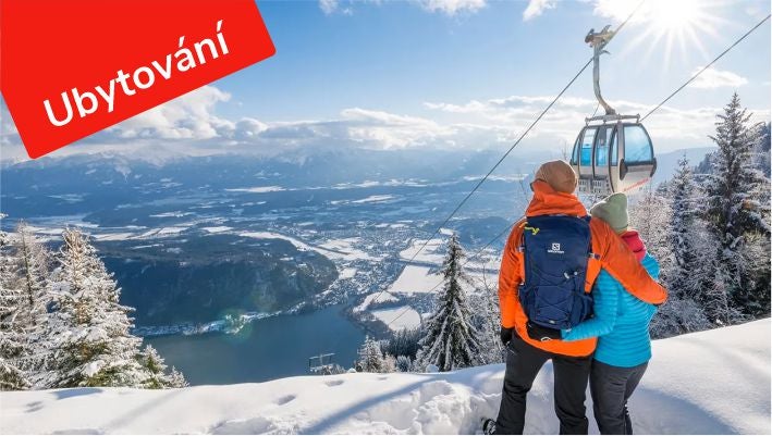 A couple at a snowy viewpoint on the Gerlitzen with a gondola and a view of Lake Ossiach, Accommodation label, © Michael Stabentheiner