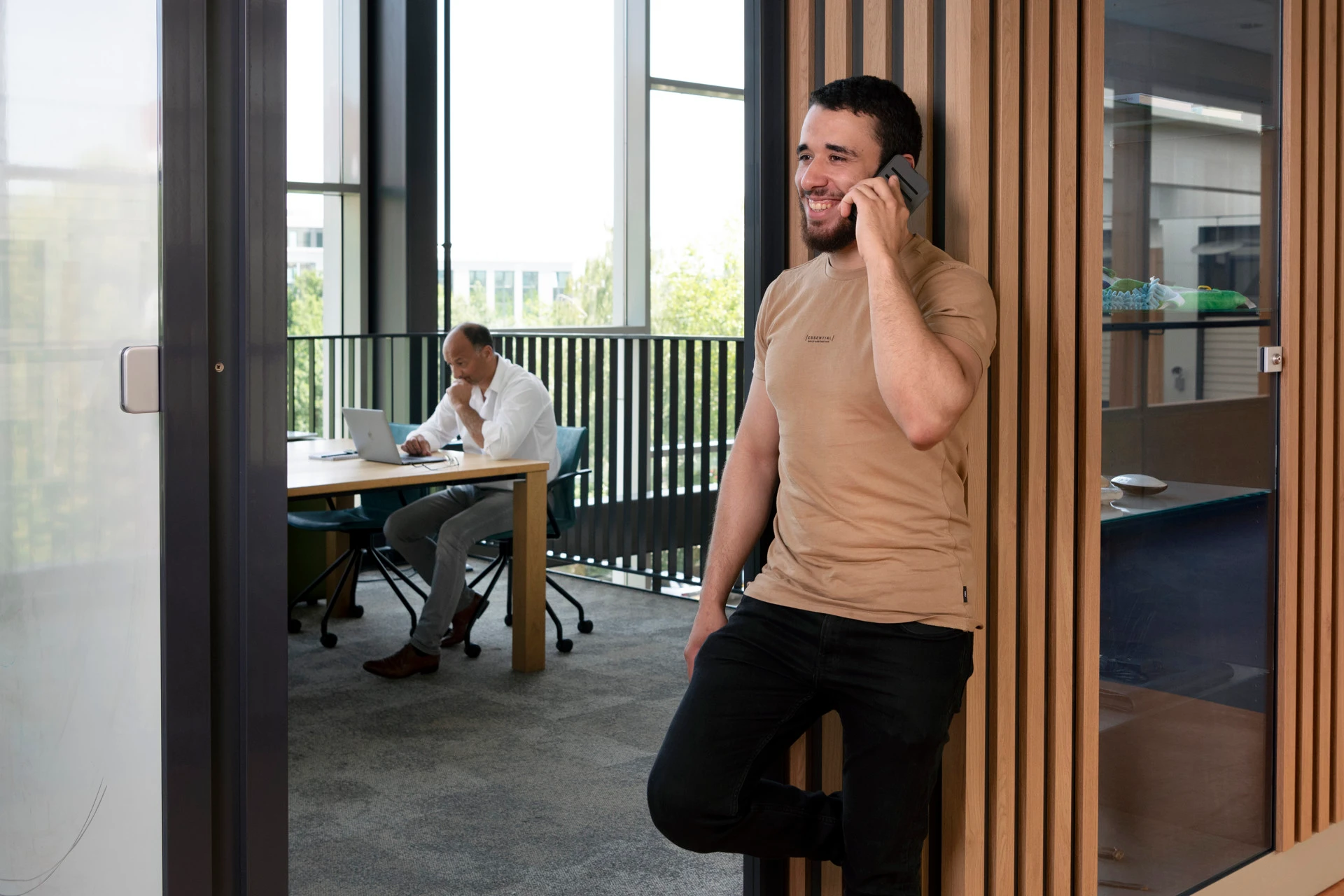 A man is calling at his office