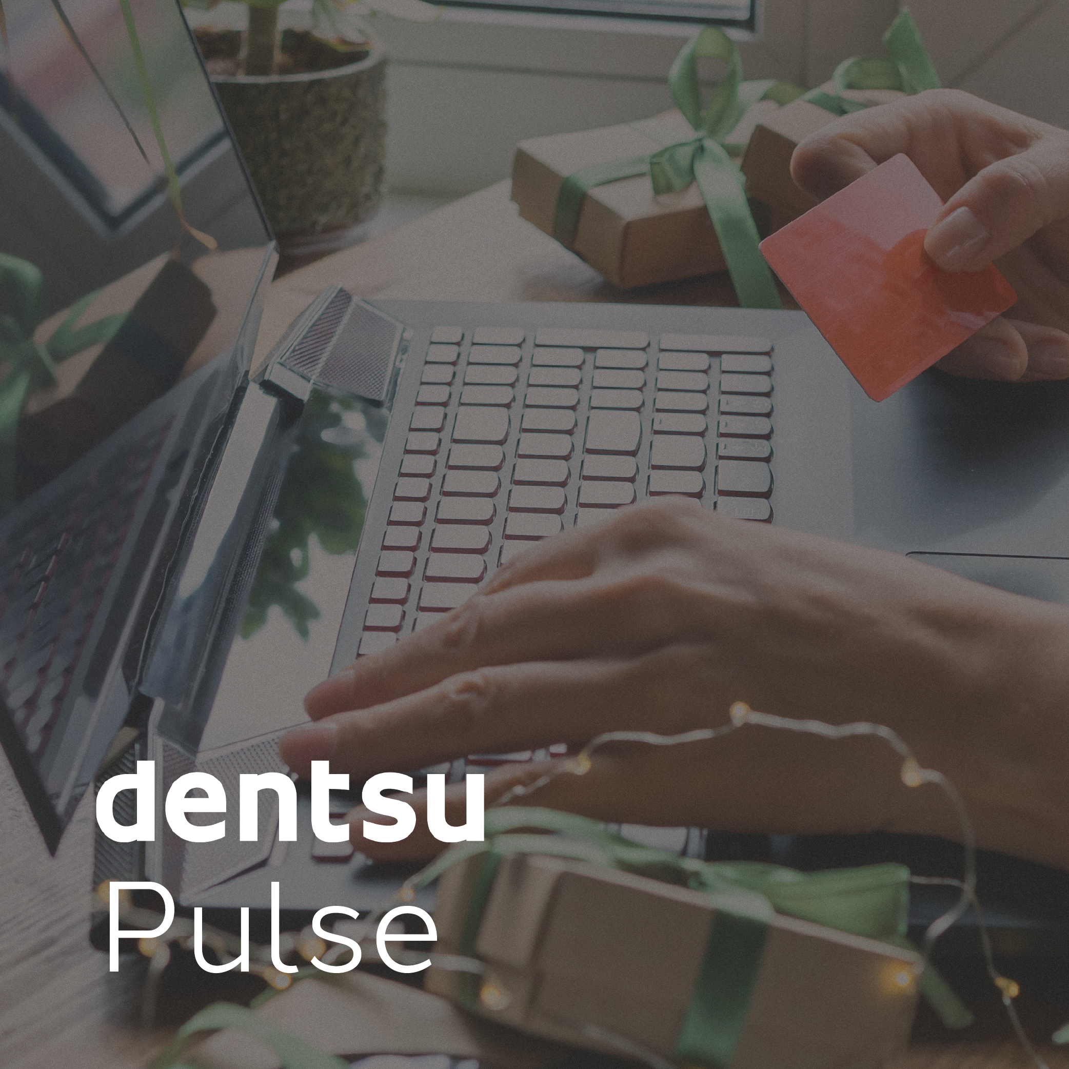 Audience at a live event with raised hands and confetti in the air, overlaid with the text 'dentsu Pulse' in white.