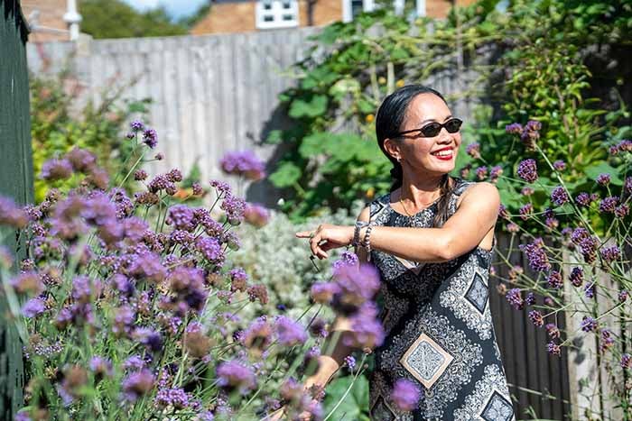 Photo of Saowanee, Sustainable Garden winner, in her garden.