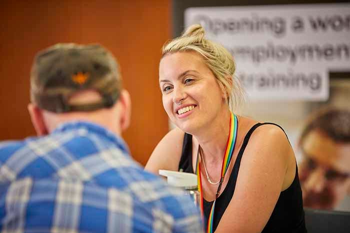 Member of staff offering advice to a customer.