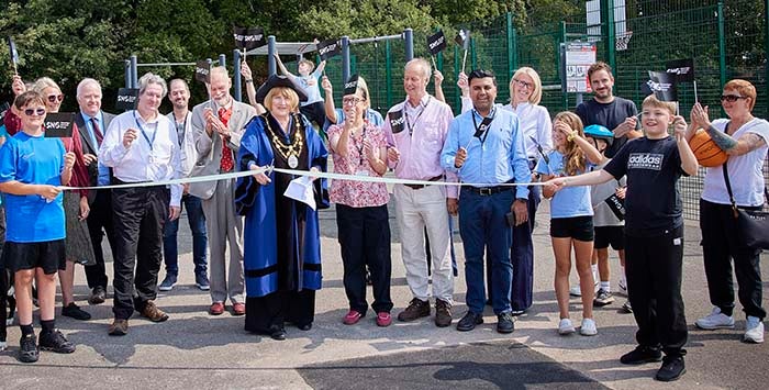Aldermoor MUGA event Southampton - a group of people gathered on a tennis court