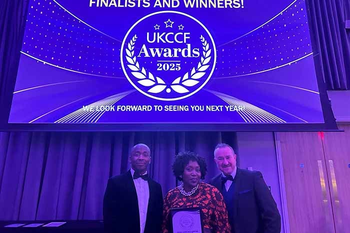 Freda Owusu and Mark Siddons receive award on behalf of the London and East contact centre 