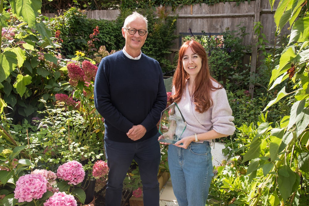 Home Garden in Bloom award winner next to SNG CEO, Mark Washer