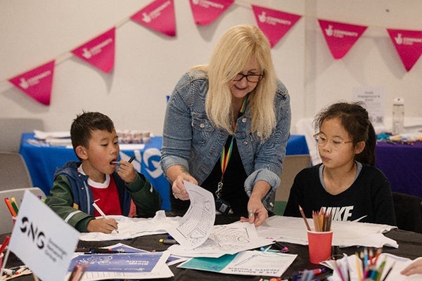 Young people receiving support from an Employment and Skills Coach at a wellbeing festival