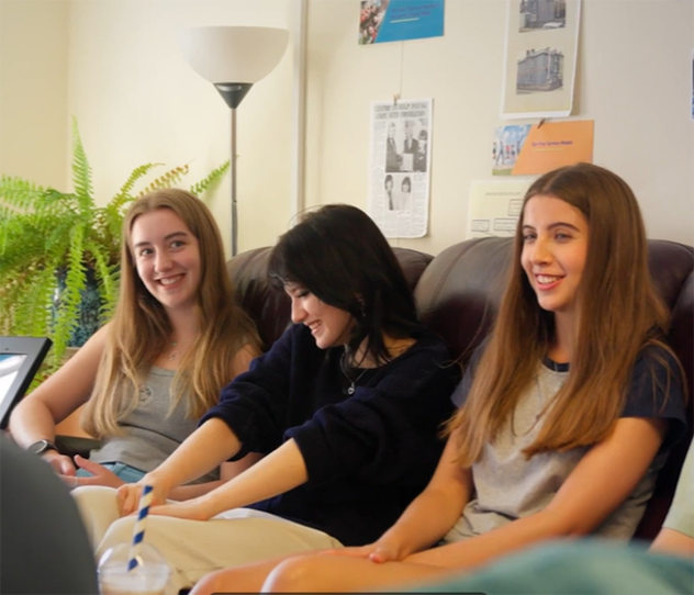 Young people sat on a sofa