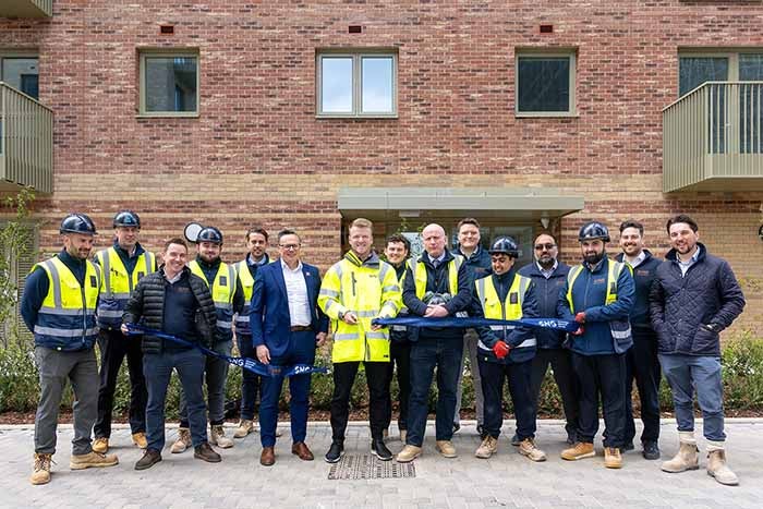 SNG, Hill and partners pose for ribbon cutting