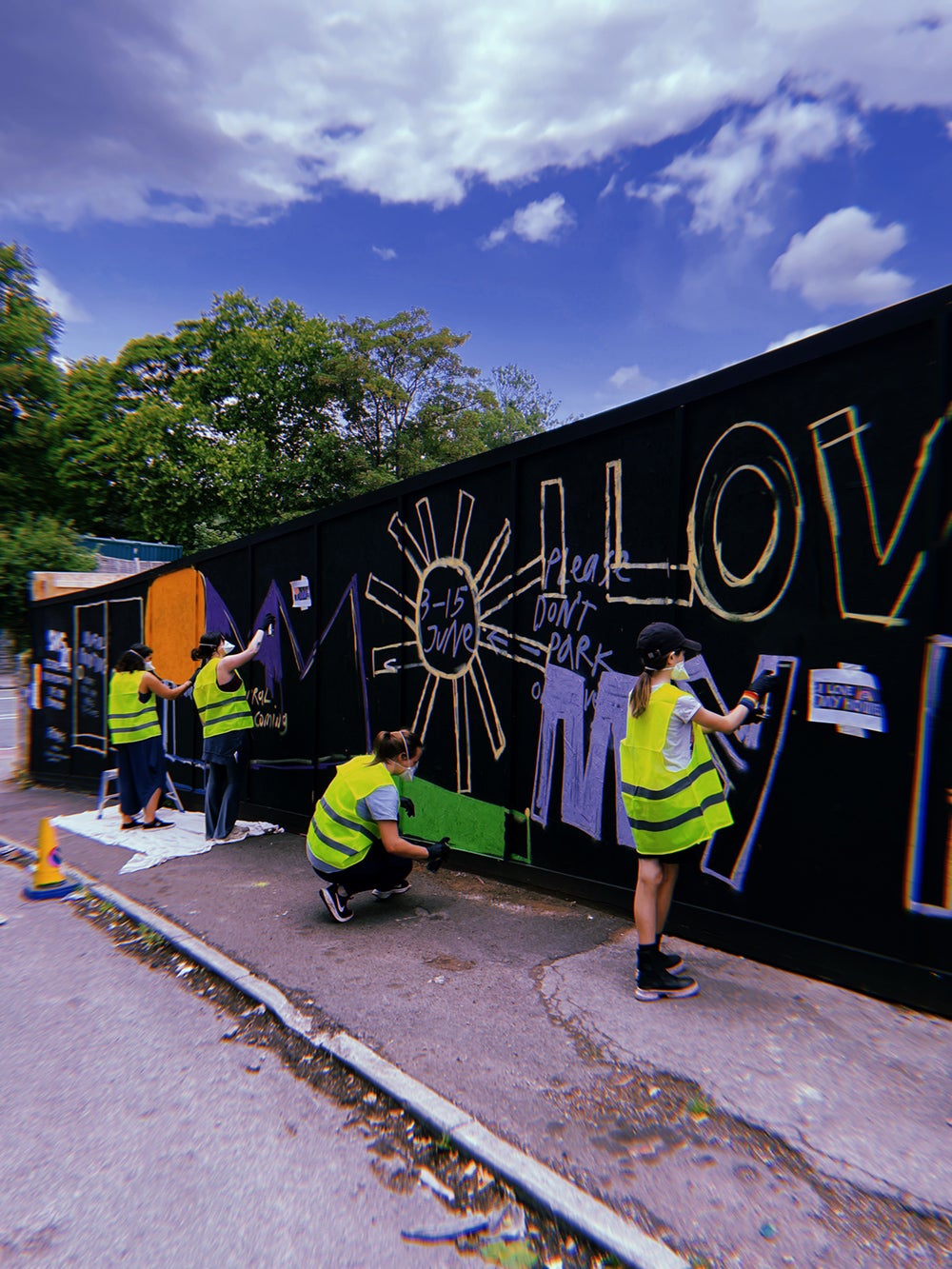 Bath Road -  Children painting development hoarding at a live painting session during the BS4 Arts Trail weekend