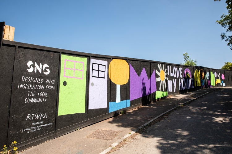 Beth Road - Close up view of a mural on development hoarding, inspired by community drawings.