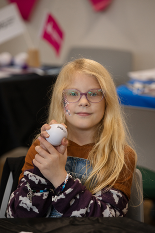 Young person engaging with SNG stress ball