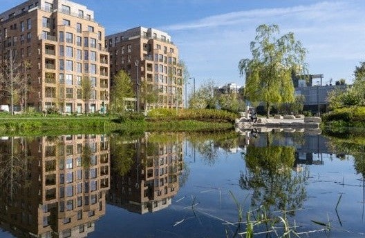 CGI of how SNG homes at Brent Cross Town will look with lake in front.