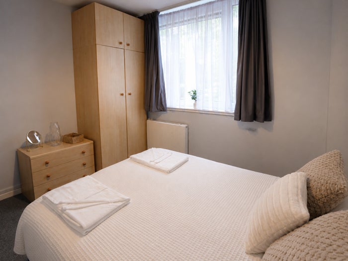 Furnished double bedroom with storage and natural light