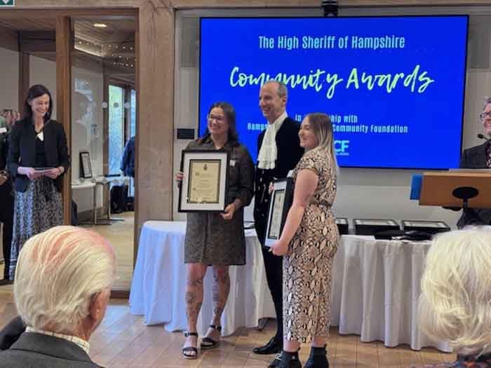 Some people receiving an award