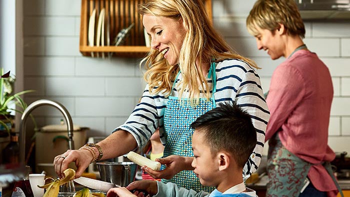 A family preparing a meal in their kitchen