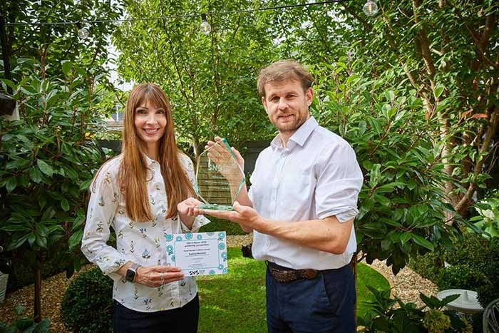 Sophia receives her award from Henry Palmer, SNG's Community Investment and Partnerships Lead
