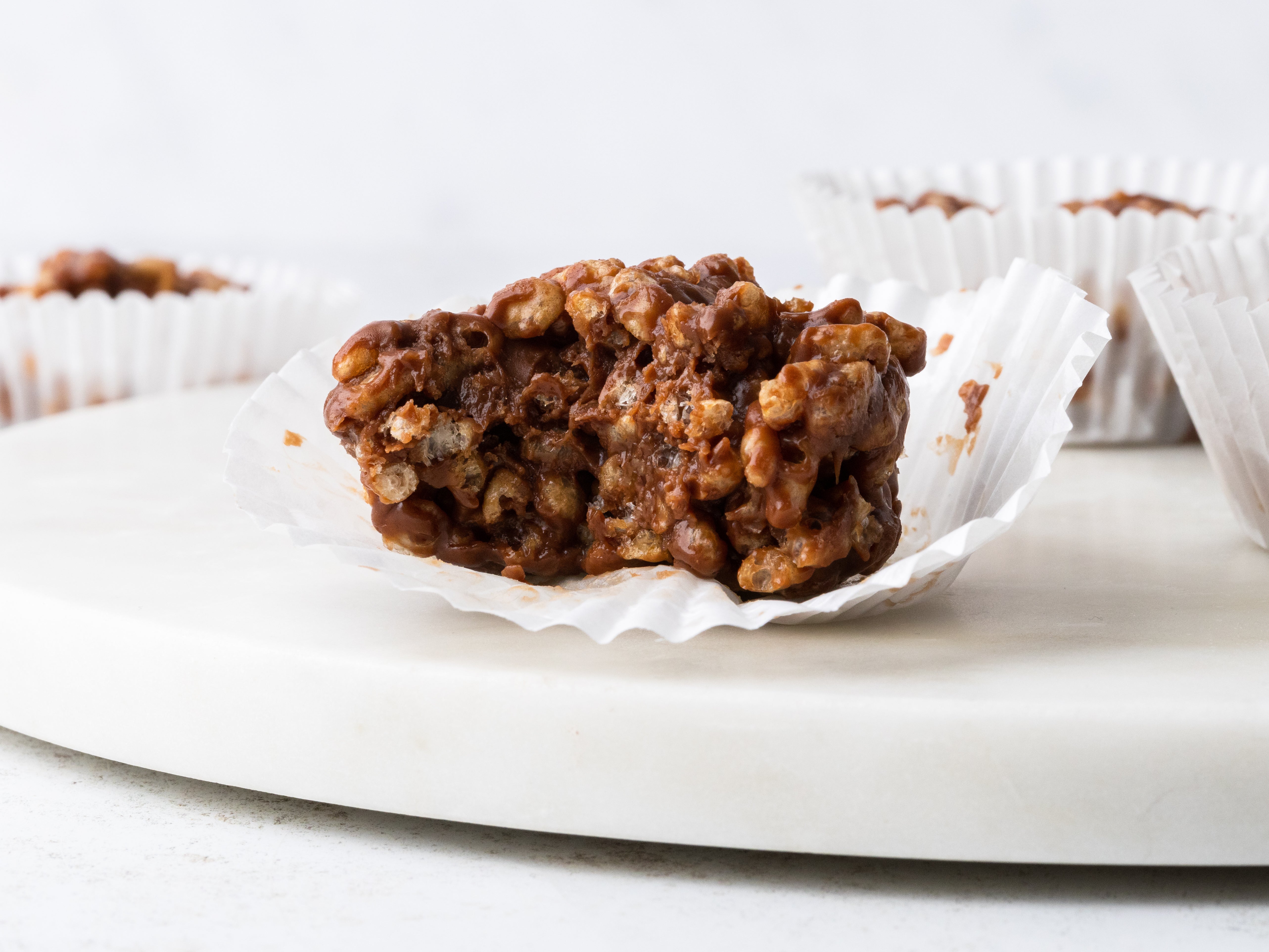 Chocolate Rice Krispie Cake with a bite taken out