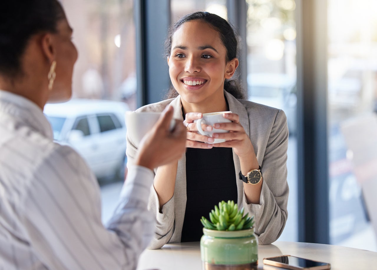 Women chatting over coffee