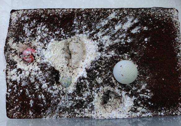 Experiment zu Kraterbildung bei Meteoriteneinschlag