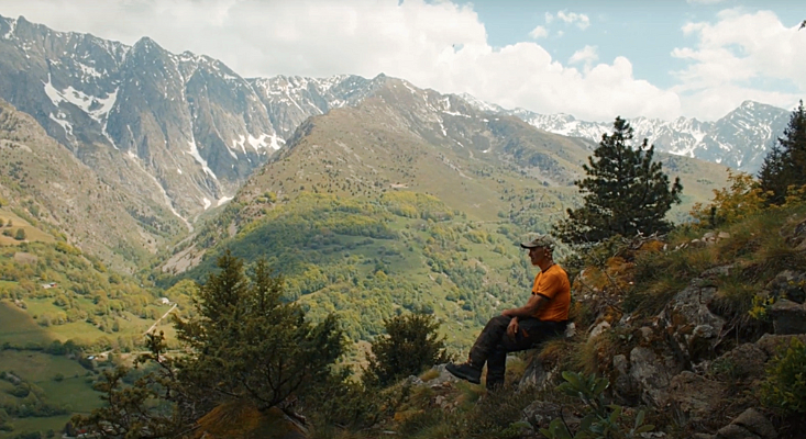 A man staring at the mountain, thinking about his life decisions