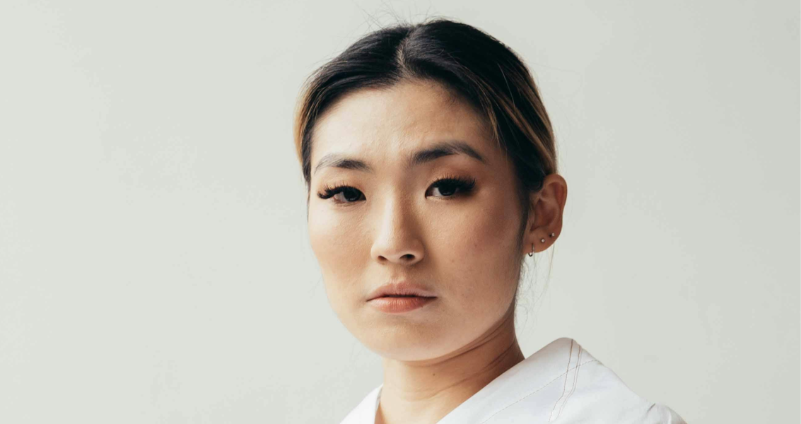 Image of the DentsuHER Intuitive Explorer Archetype: A woman wearing a white shirt, embodying the essence of strategic exploration and targeted appeal for Hong Kong brands.