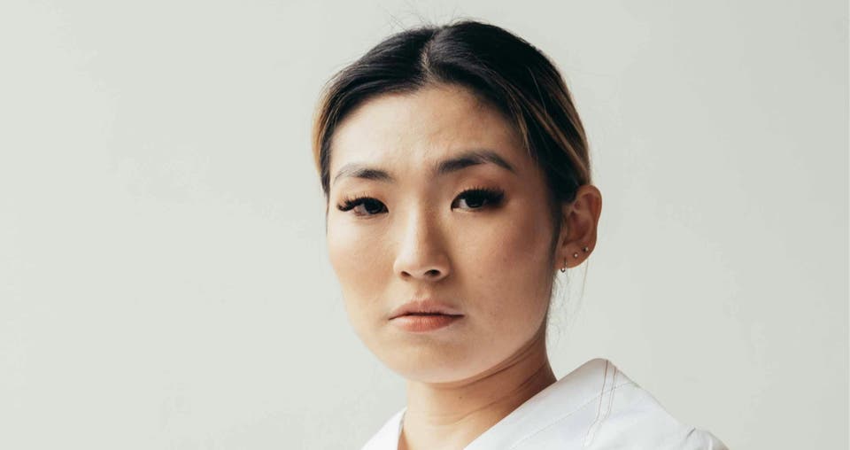 Image of the DentsuHER Intuitive Explorer Archetype: A woman wearing a white shirt, embodying the essence of strategic exploration and targeted appeal for Hong Kong brands.