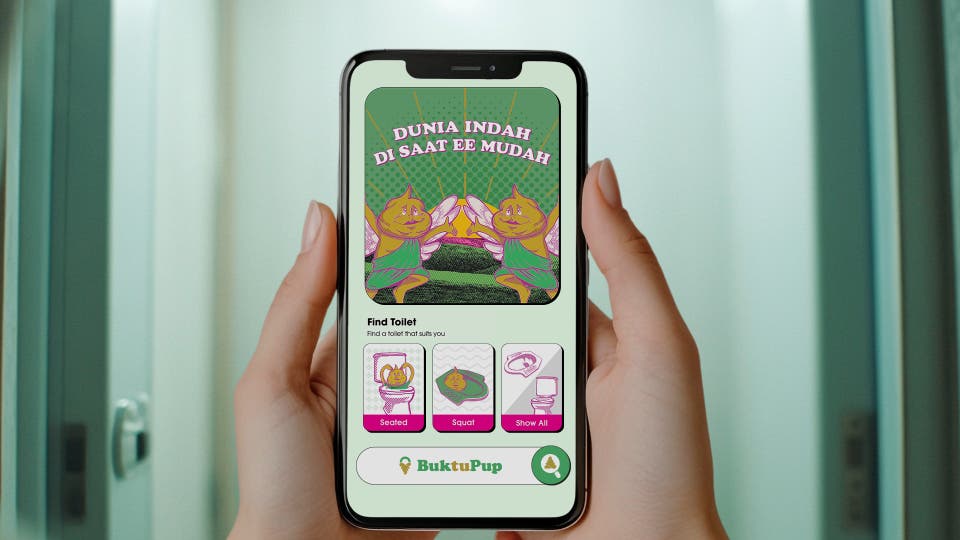 Someone using the BuktuPup app, a peer-to-peer toilet rental microsite done by dentsu Indonesia for Microlax, to showcase its homepage