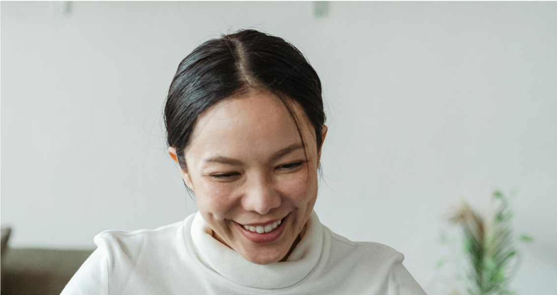 Image: DentsuHER archetype: Compassionate Planner. A woman radiating strength and positivity, prioritizing a cozy life, harmonious relationships, and well-being. Mindful of privacy, health-conscious, and financially savvy.