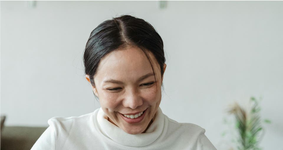 Image: DentsuHER archetype: Compassionate Planner. A woman radiating strength and positivity, prioritizing a cozy life, harmonious relationships, and well-being. Mindful of privacy, health-conscious, and financially savvy.